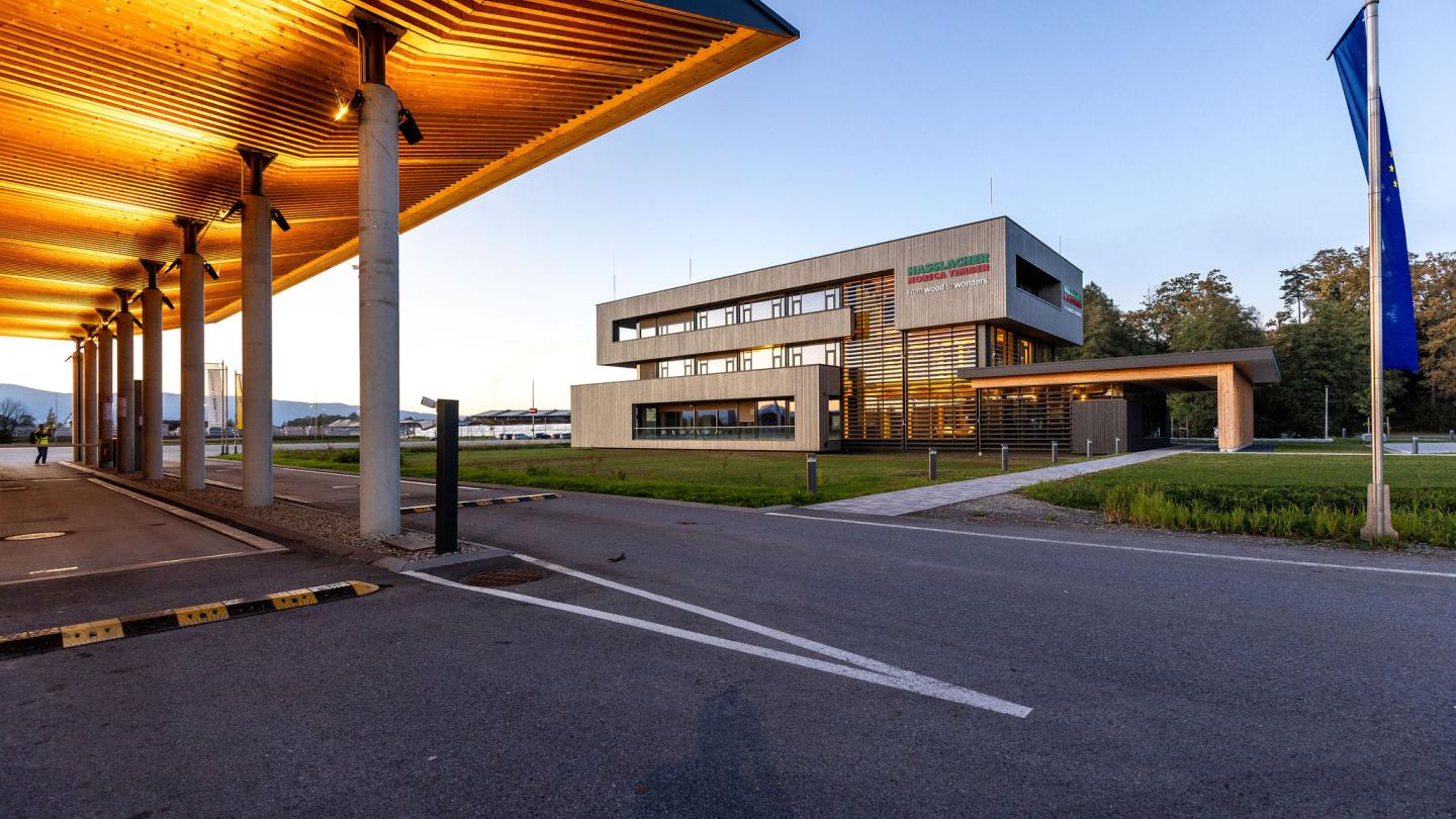 The new office building of HASSLACHER PREDING Holzindustrie, terminal with office building in the background