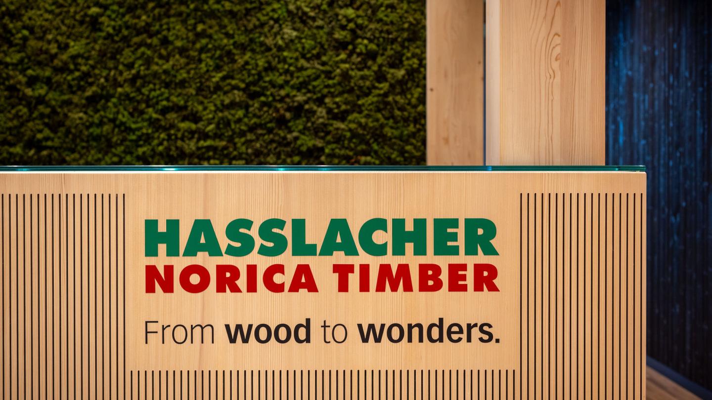 The new office building of HASSLACHER PREDING Holzindustrie, counter with logo inside