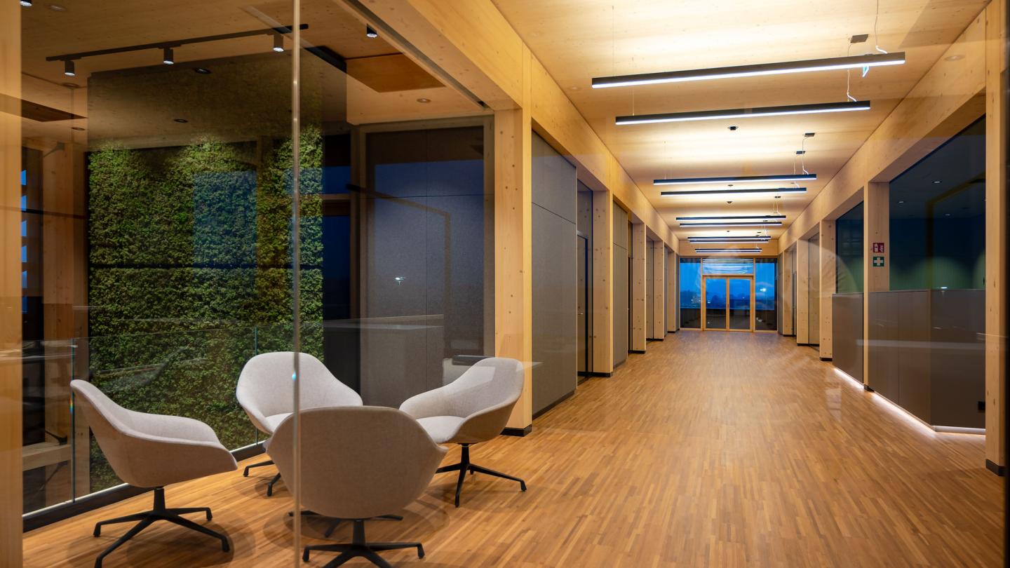 The new office building of HASSLACHER PREDING Holzindustrie, interior 1st floor corridor with seating area