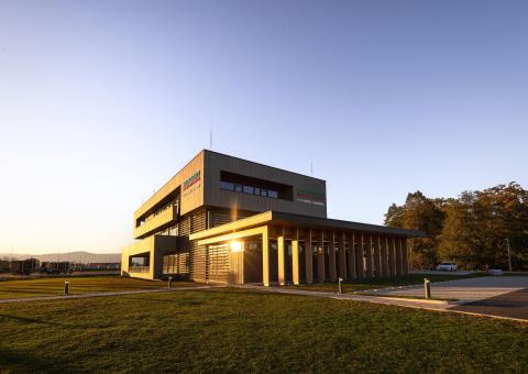 The new office building of HASSLACHER PREDING Holzindustrie, exterior view in sunlight