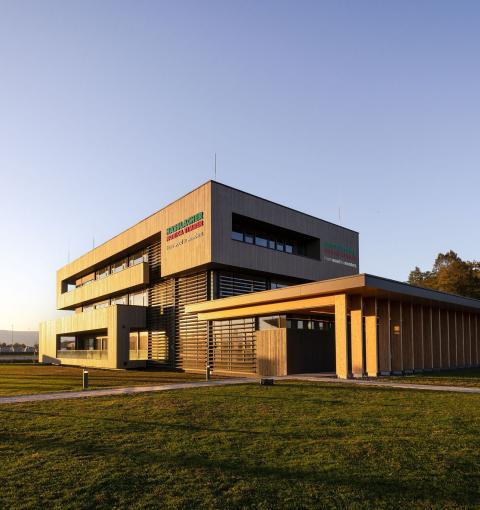 The new office building of HASSLACHER PREDING Holzindustrie in sunlight