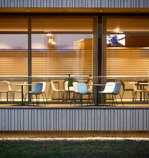 The new office building of HASSLACHER PREDING Holzindustrie, exterior terrace illuminated